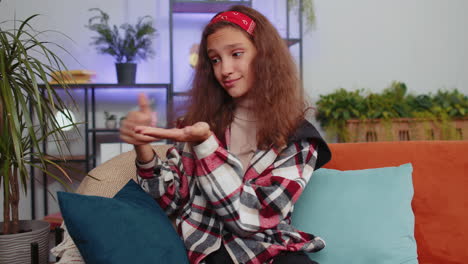 young woman sitting on a couch and smiling