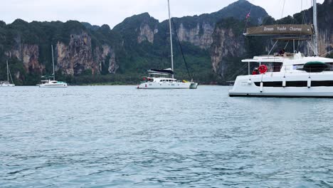 yacht cruising near scenic cliffs in krabi