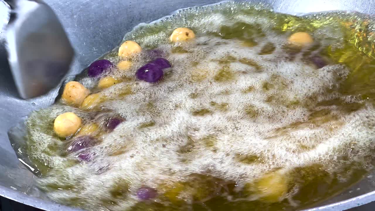 Street food preparation in hot oil