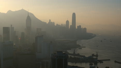 high view overlooking victoria harbour including both hong kong island and kowloon at late afternoon