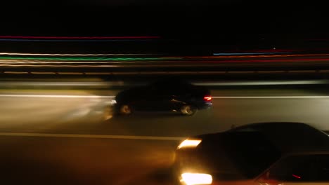 side view point of view of traffic congestion at highway at night time lapse