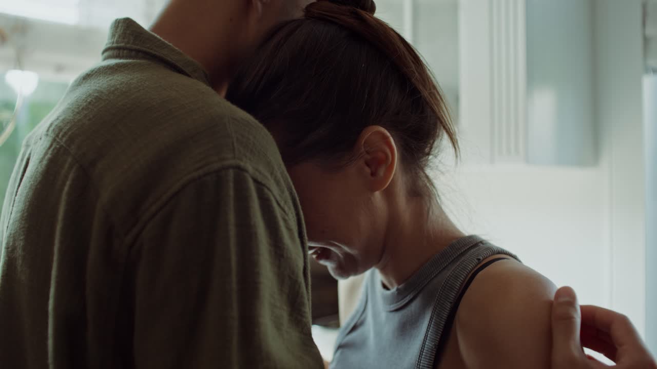 Couple Hugging in Kitchen