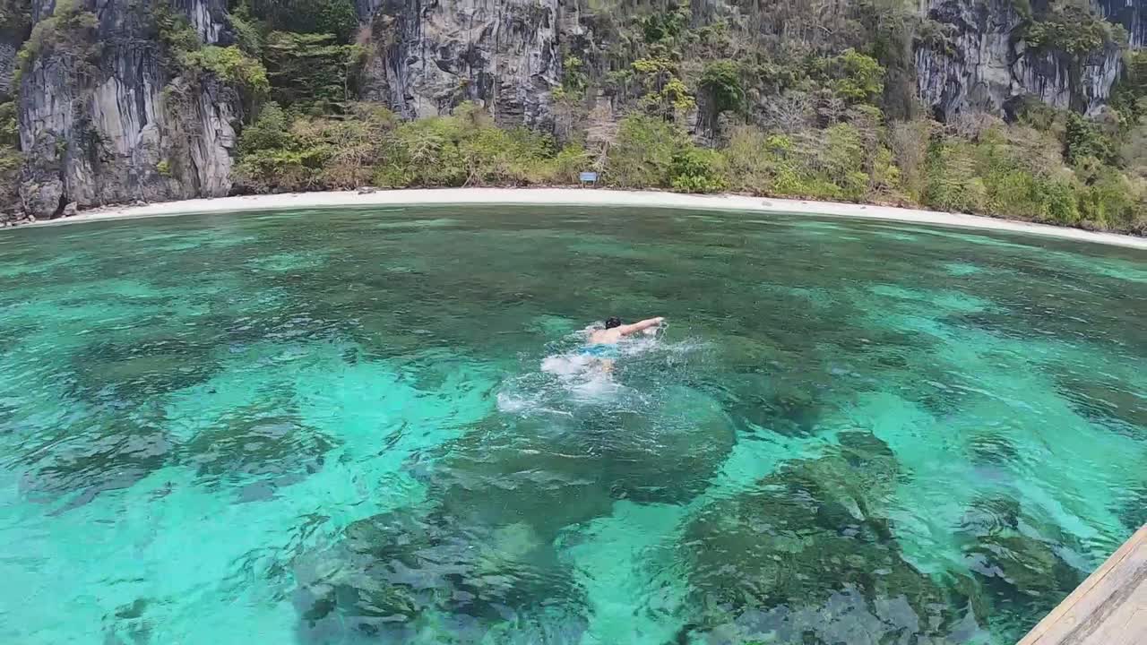 Snorkeling on a deserted paradise island with turquoise waters, Ko Yung, Thailand