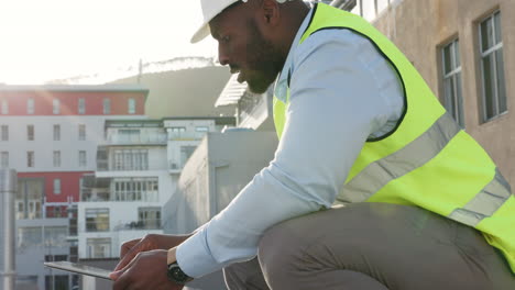 modern engineer working on a tablet at an outside