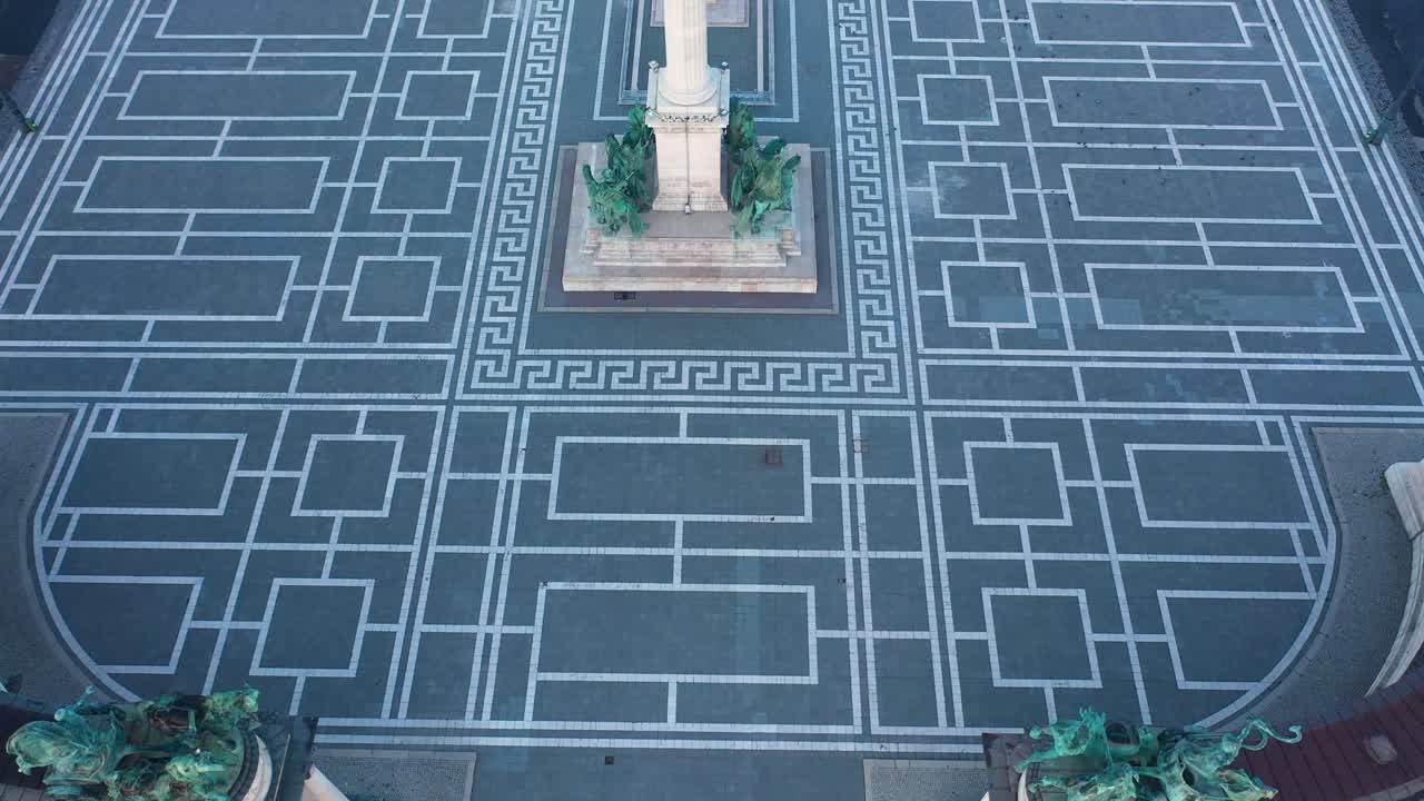 Drone footage of the empty Heroe's Square in Budapest, Hungary at the time of the Covid virus. Early morning at the sunrise in spring.
Drone flies forward slowly and looks down.