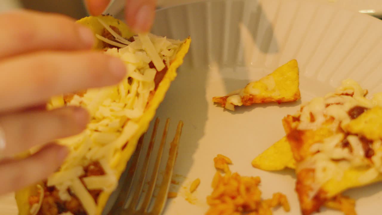 Filling Mexican Taco with Cheese After Filling with Spicy Beef Mince