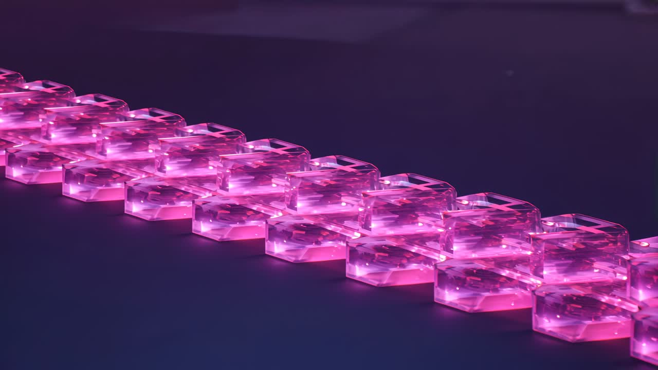 Translucent hexagonal blocks emitting pink glow and creating reflections on reflective tabletop
