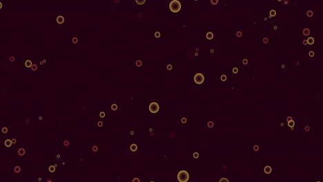 animation of yellow and red spots of light jumping in hypnotic motion on black background