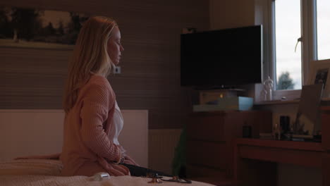 a woman relaxing in her bedroom