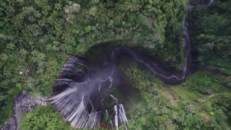 Thousand-Waterfall-Tumpak-Sewu-in-lush-rainforest,-East-Java,-top-down