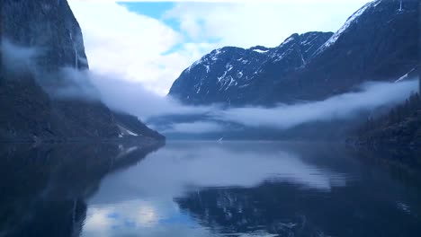 incredible clouds and fog hang over a fjord in norway in timelapse 1