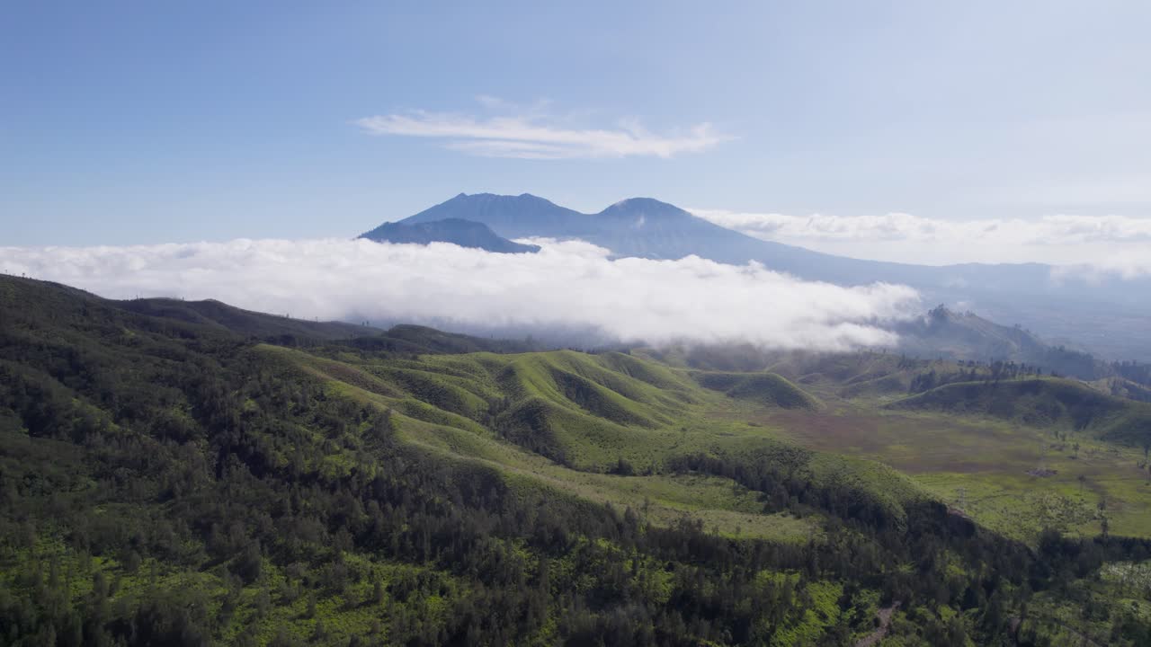 Aerial view of beautiful sky in misty mountains nature in the distance covered in clouds