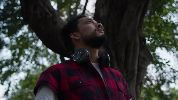 Man with Headphones in a Park