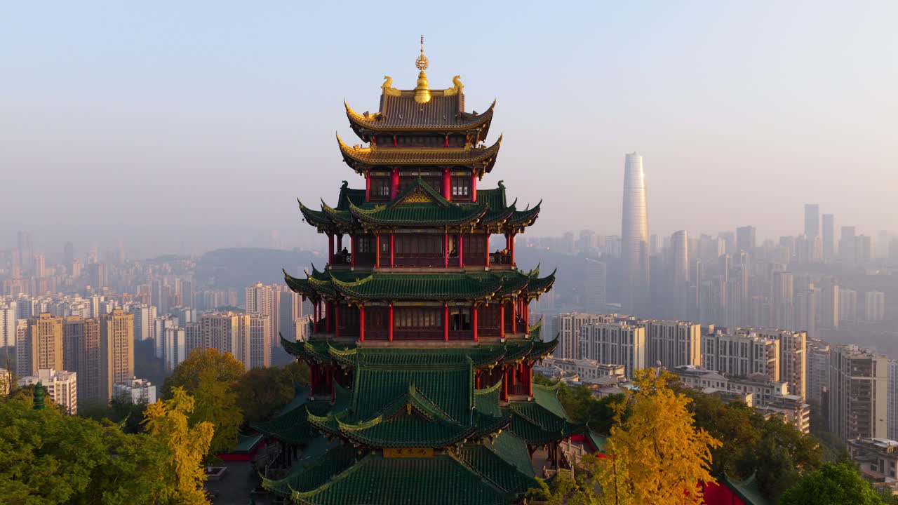 Hong'en Pavilion With Traditional Chinese Architecture Against A Modern City Skyline Of Chongqing, China. - aerial shot
