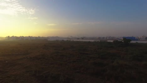 Drone-shot-showing-a-man-jogging-on-a-Foggy-morning