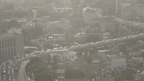 rooftop shot of a traffic on a bridge