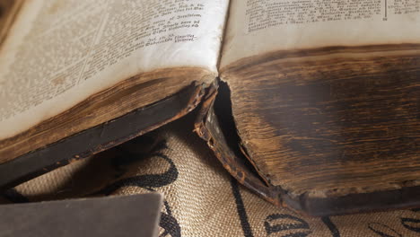 cinematic sliding shot of mysterious and open historic book, close up shot