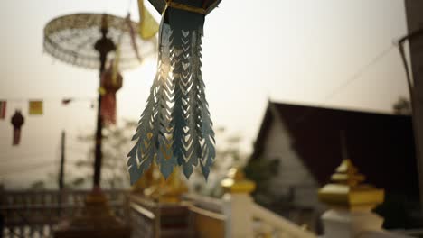 sunlight illuminates traditional temple decorations