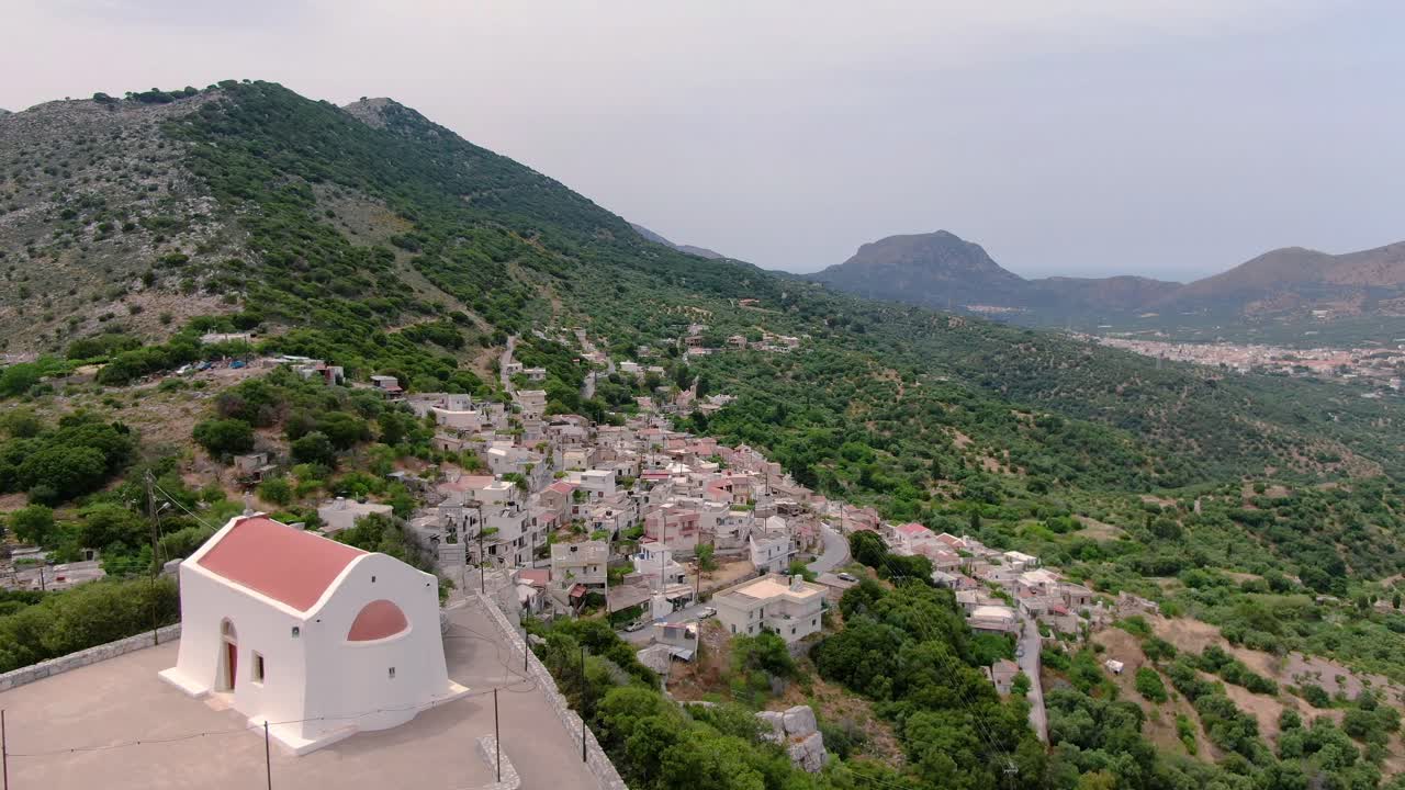 Aerial view of small church and picturesque village