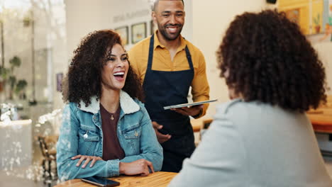 customers ordering food at a cafe