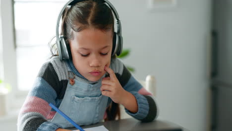 Homework,-thinking-and-child-with-headphones