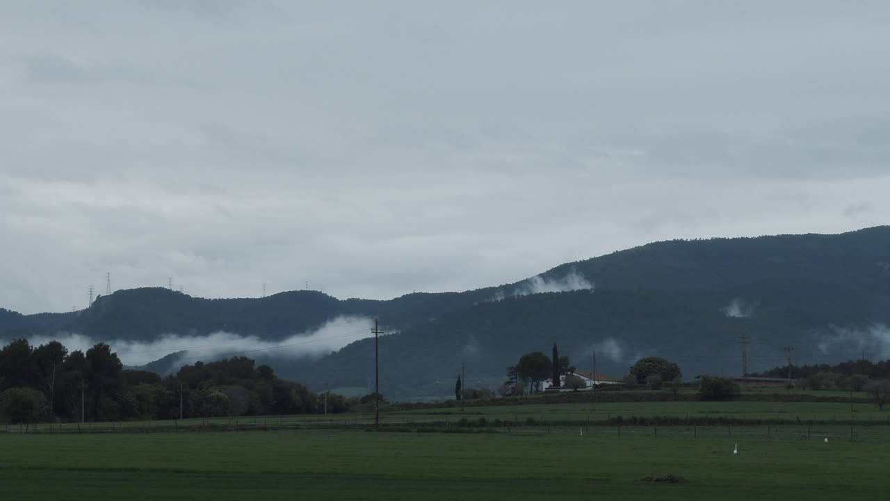 Timelapse of how clouds move smoothly above the forest after a storm