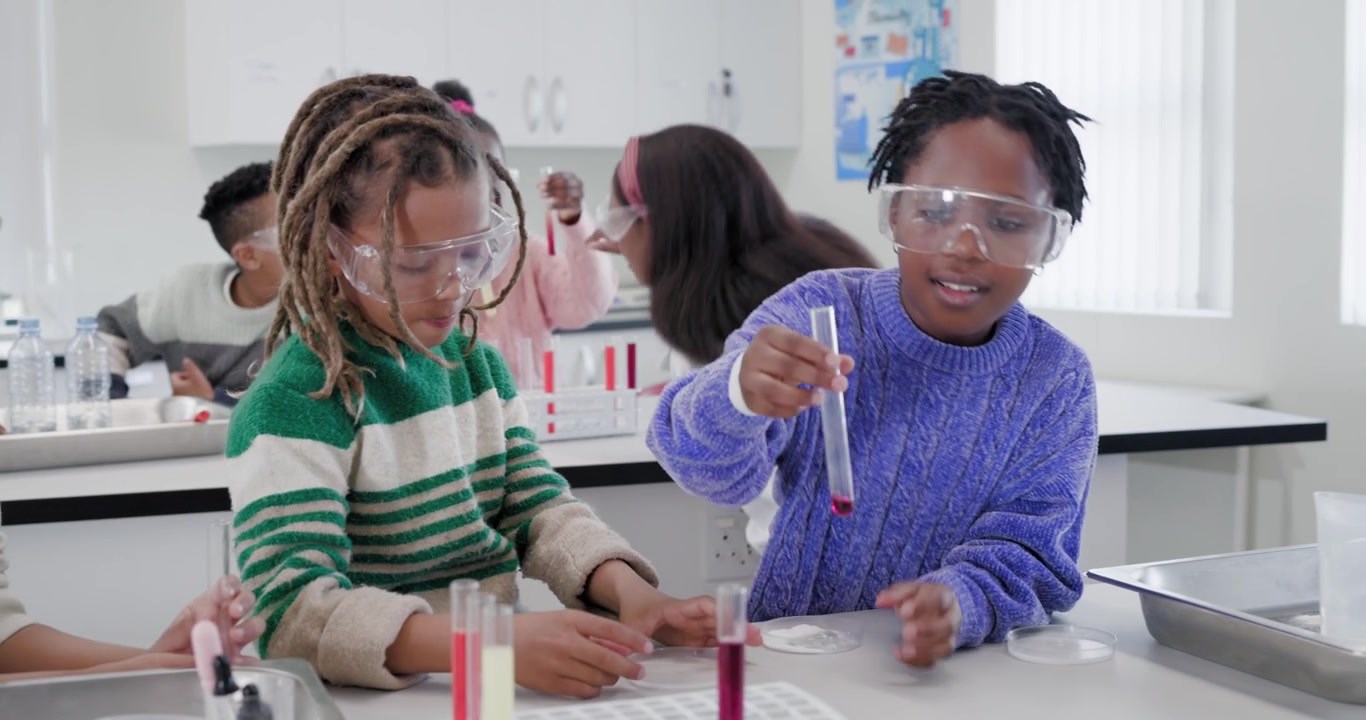Diverse youth in lab with teacher in goggles after prompt, pouring fluid into test tubes