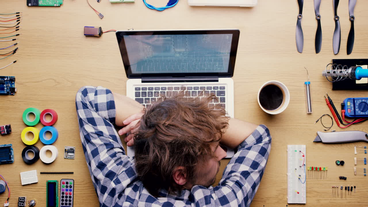 Tired Programmer Taking a Nap During a Project