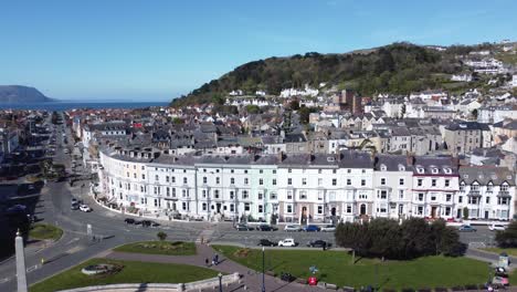 beachfront aerial view llandudno seaside coastal holiday town tourism resort hotels rising pan left