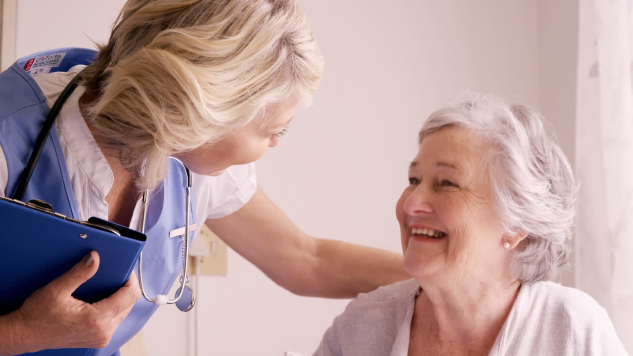 Female doctor consoling to a senior woman