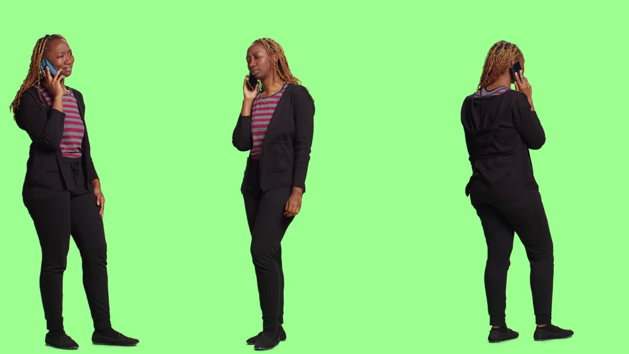 Businesswoman Talking on Cellphone in Studio