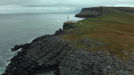 aerial footage of neist point on the isle of skye, scotland, uk. standing at 62ft, neist point is one of the most famous lighthouses in scotland and can be found on the most westerly tip of skye.
