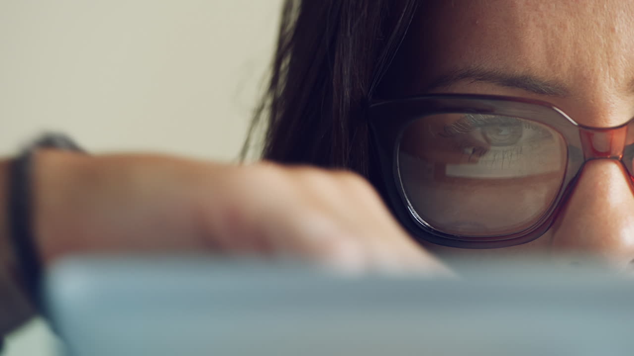 Attractive young woman using digital tablet computer touchscreen ipad