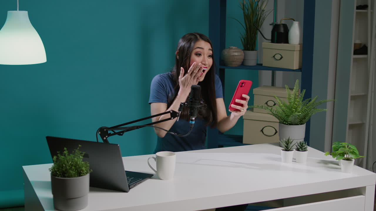 Female blogger answering social media comments on live podcast