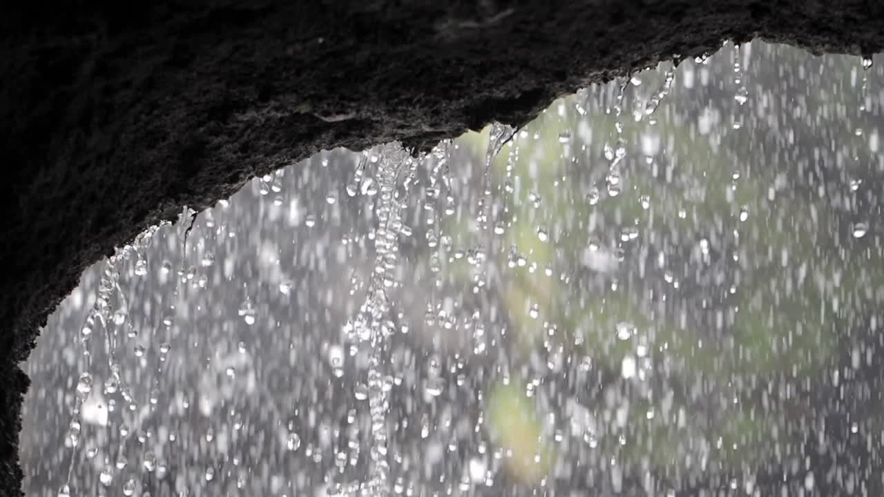 Rainy day under a rocky overhang