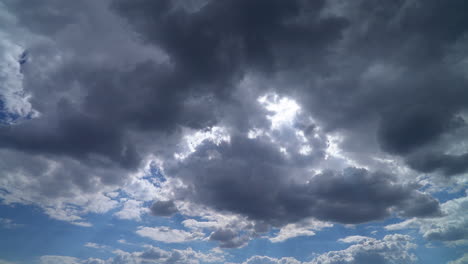 fluffy white clouds drifting across a clear blue sky