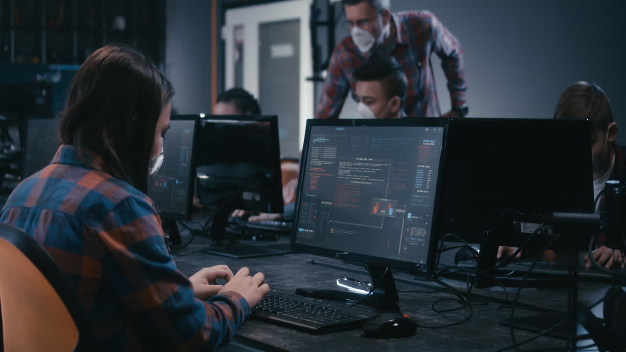 Students learning coding in a computer lab
