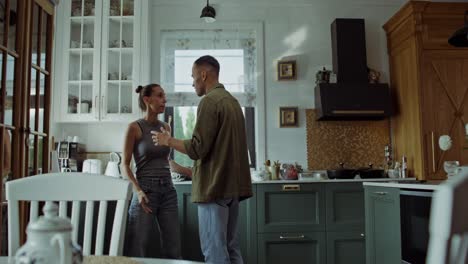 couple arguing in a kitchen