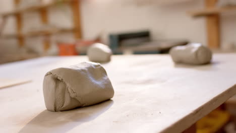 clay lying on desk in pottery studio