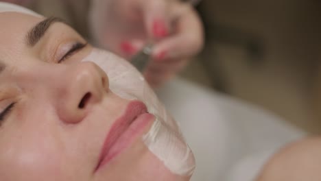 a soothing facial treatment with a thick layer of alginate mask being applied for skin rejuvenation and hydration