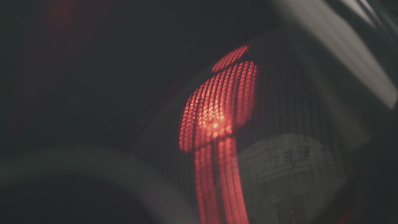 Close-up of a red car tail light at night