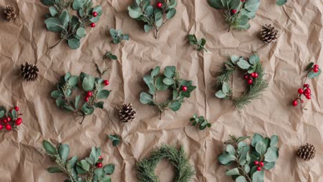 christmas wreath arrangement on kraft paper