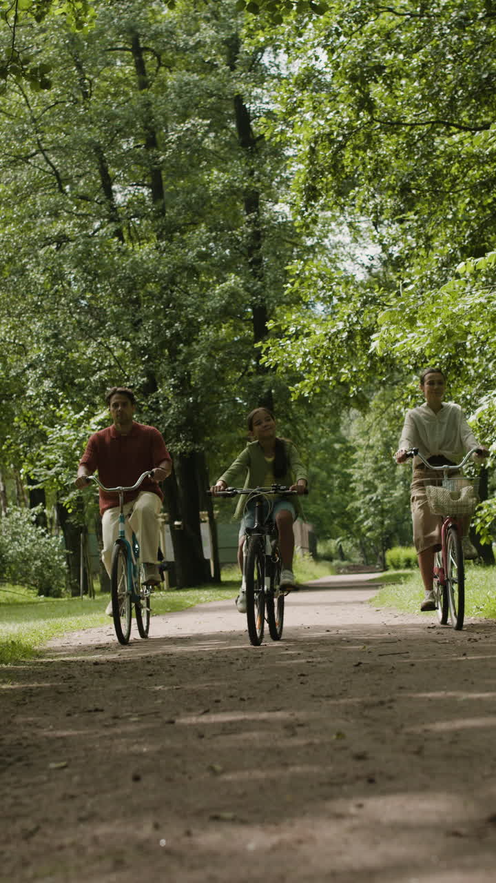 Family bike ride in the park