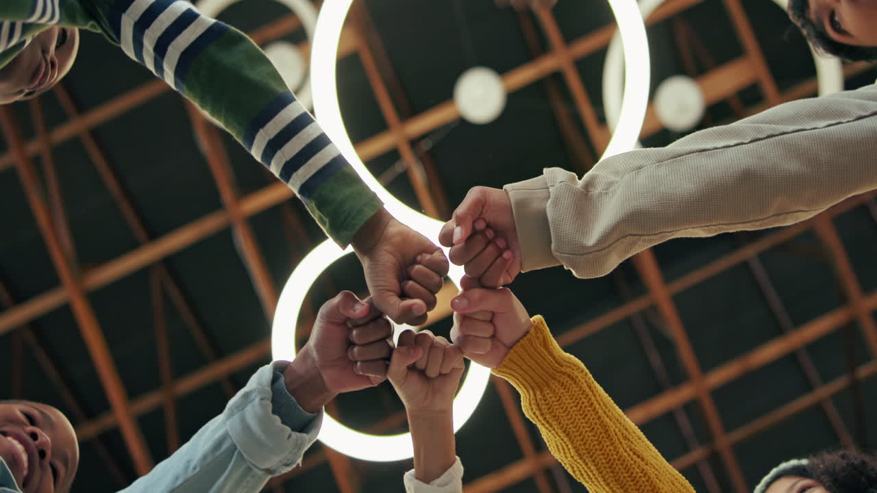 Team celebrating success with fist bump