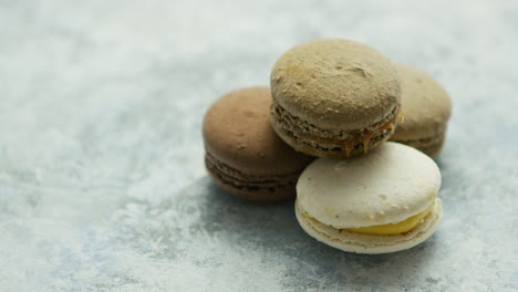 delicious macarons pastries on marble