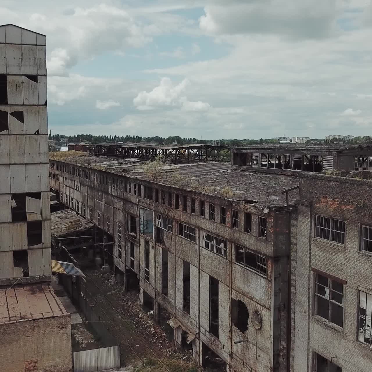 Flight over the destroyed factory. Old industrial building for demolition. Aerial view