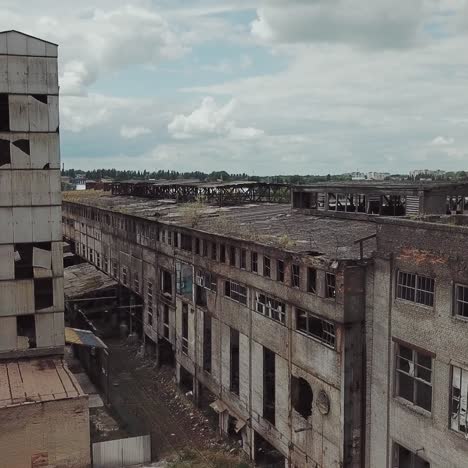 flight over the destroyed factory. old industrial building for demolition. aerial view
