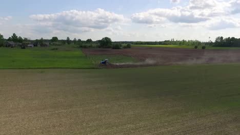 Country-side-panoramic-landscape-in-summer-time-from-above-and-ground-with-hay-rolls-and-roads