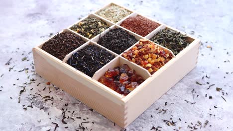 various kind of dry tea in wooden box