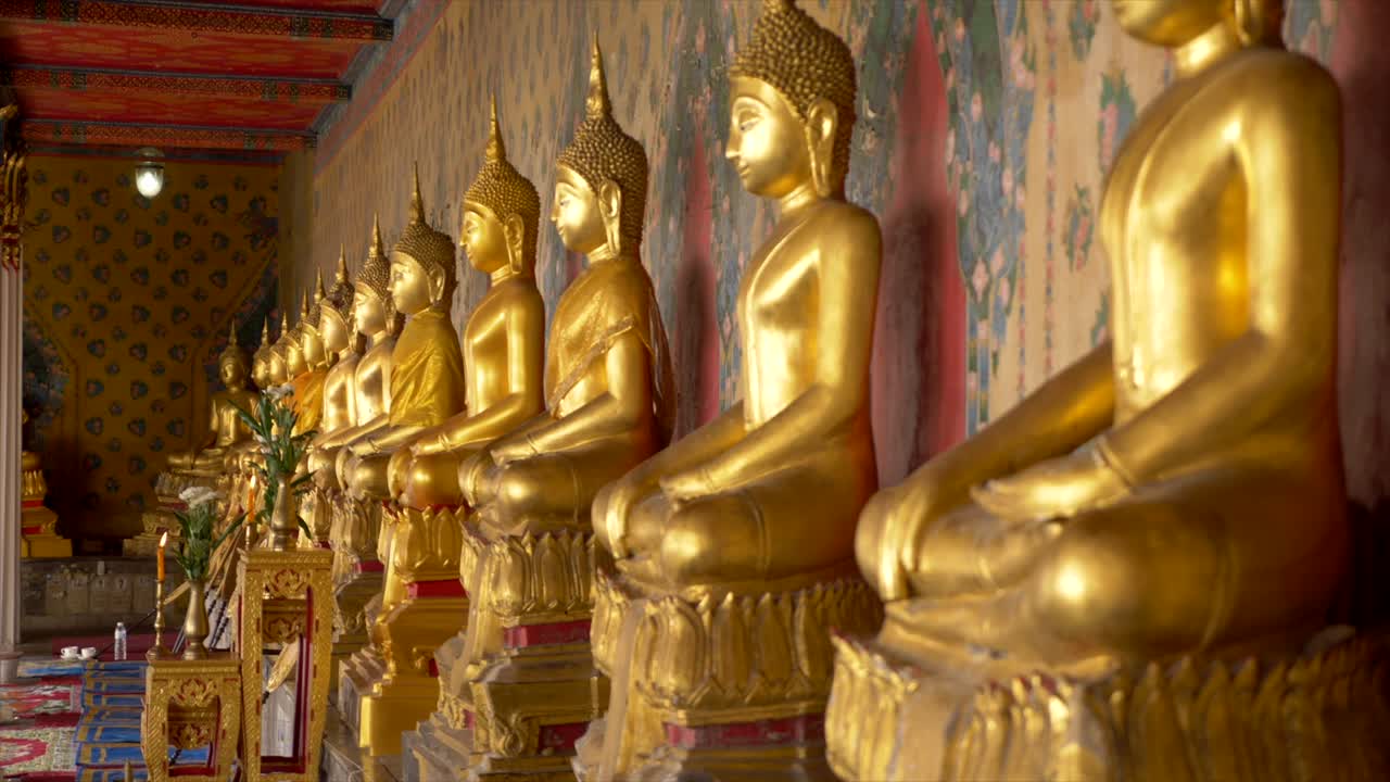 Slow motion shot of divinity statues in line on a temple close-ups of intricate details. Perfect for travel, cultural, and religious themed projects.